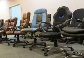A display lineup of executive, mesh, and ergonomic office chairs Malaysia in various styles and materials.