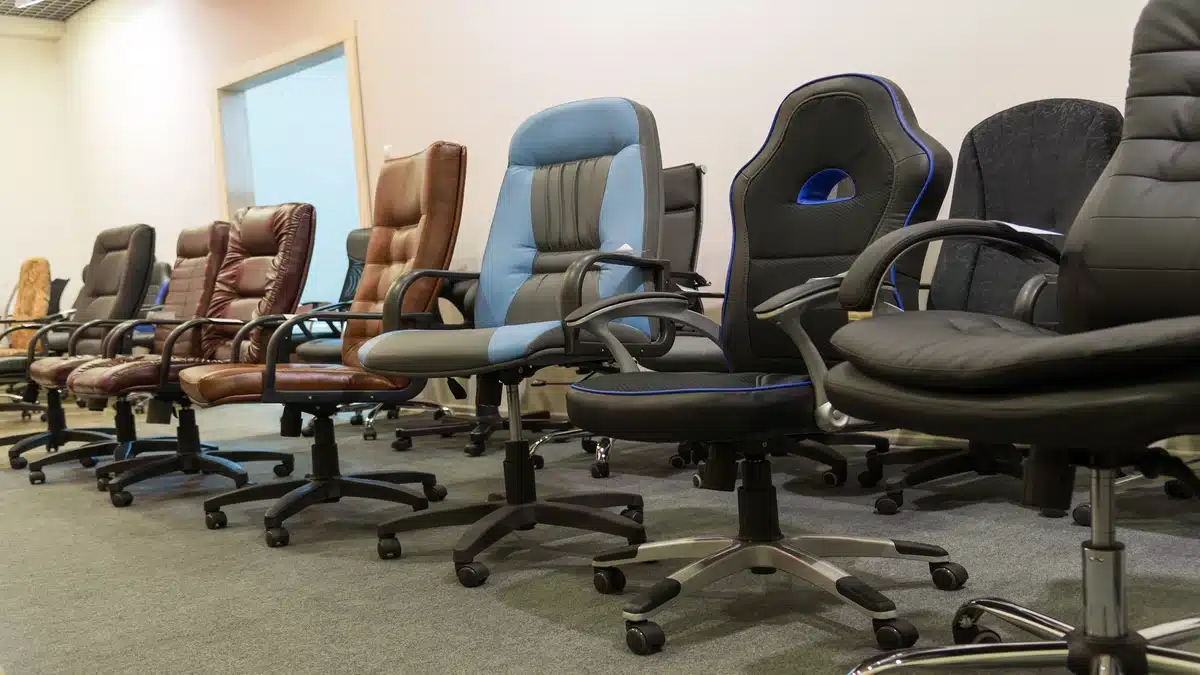A display lineup of executive, mesh, and ergonomic office chairs Malaysia in various styles and materials.