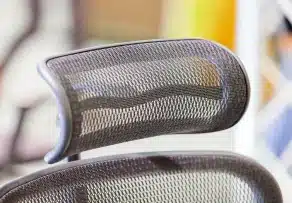 Detailed view of mesh headrest and back support on an ergonomic office chair Malaysia.