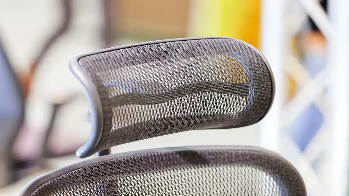 Detailed view of mesh headrest and back support on an ergonomic office chair Malaysia.